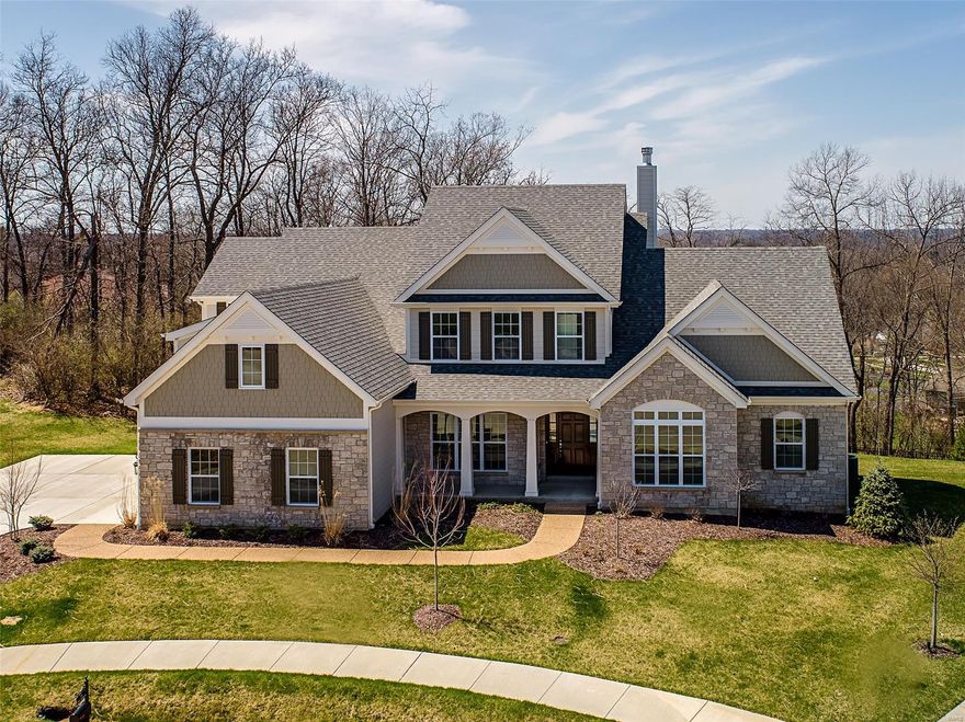 Spectacular 1.5 story by Prestige Custom Homes on a large walkout homesite on cul-de-sac in Belle Maison subdivision.  This 4 bedroom, 3.5 bath, home features a 3-car side entry garage, outdoor room with fireplace and vaulted ceiling, job stained hardwood flooring, gourmet kitchen with custom cabinetry, crown molding, soft close drawers, granite countertops, Kitchen-Aid stainless steel appliances, under cabinet lighting, built-in lockers, and impressive hearth room with vaulted ceiling and stone fireplace.  Soaring 2-story great room offers a fireplace, wood beamed ceiling, hardwood floors, wet bar with beverage coolerand wine rack,  study with vaulted ceiling built-in bookcases. Elegant master bath suite boasts coffered ceiling, separate walk-in closets, adult height vanities, stand alone tub,and vaulted ceiling in master bath.  Other amenities include a expansive 2nd floor bonus room. Additional Rooms: Mud Room