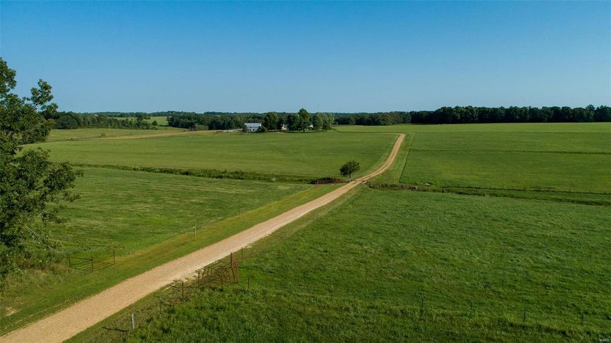 Missouri Century Farm with approximately 120 acres in the heart of Gasconade County. Original log home has been well maintained by the family for generations. Main residence hosts 4 bedrooms, 2 baths & an open concept dining/living area. Large kitchen has some of the original logs exposed & wood floors to enjoy. Majority of acreage is open, fenced/cross fenced and includes 4 energy free watering systems. Two stocked ponds & a wet weather creek are great for recreation, fishing & hunting! 36x52 shop is predominately finished, heated and insulated with one overhead garage door & one sliding door. Oversized detached garage, barn, pole barn, quonset hut and a storage shed.  Separate guest house/hunting cabin with an open concept design has a kitchenette, bedroom & a full bath. Secluded from roads & traffic but only minutes from conveniences. Agent owned & priced under recent appraisal!