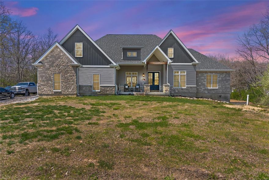 Welcome to this stunning 1.5-story home on over 3 wooded acres Just 4 years old, this 4-bedroom, 2.5-bath, a spacious 2-car garage.  Step into the inviting entry foyer. The main floor boasts a luxurious primary suite with a walk-in closet, spa-like bath, and easy access to the main floor laundry and mudroom. The heart of the home is the beautiful kitchen, complete with a walk-in pantry, elegant brushed nickel fixtures, and open sight lines to the living and dining areas. Has zoned HVAC and seamless indoor-outdoor living with a covered front porch and covered back deck—perfect for taking in the serene, wooded views. Upstairs, a loft area offers endless possibilities with a roughed-in half bath. The lower level expands your living space with a bonus room and a full bath rough-in, ready for your custom touch.
This home offers the ideal blend of peaceful country living with modern upgrades and thoughtful features throughout. Don’t miss your chance to own this wooded retreat! Additional Rooms: Mud Room