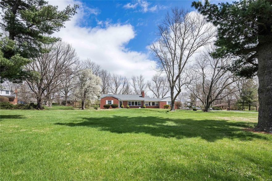 Prestigious and central location, you cannot beat this beautiful and expansive corner lot in Town and Country for the setting for your dream home! A lovely building lot surrounded by million dollar luxury homes, you’ll be the center of attention at this premium setting. The home is included as-is but very livable and extremely well-maintained by its lovely current owners who have enjoyed over six decades in this home. Live in the home while you plan your custom home if desired. The lot allows for many options for a grand home with circle drive. Make an appointment today to bring your builder and walk the lot to imagine the possibilities that await you at this luxury location. For impressive living, it doesn’t get any better than a “show me” prominent site like this one!