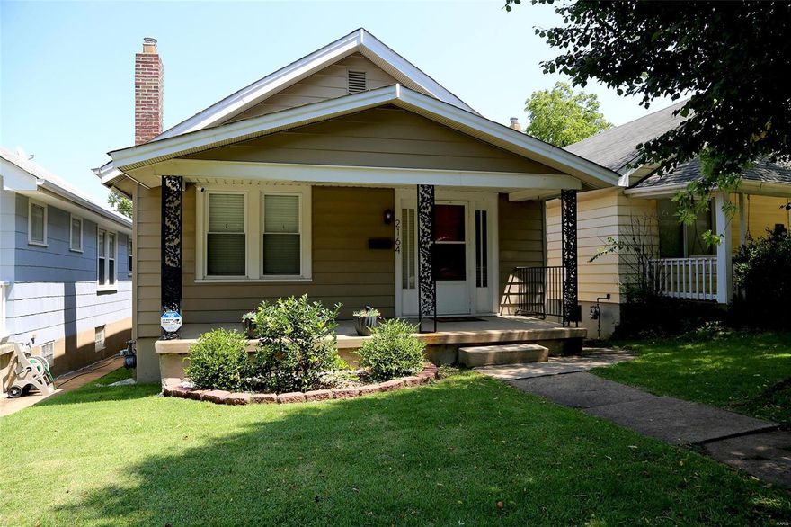 CONVENIENT i-44/HAMPTON AVENUE LOCATION! Totally rehabbed & move-in ready! Enter off the welcoming covered porch into spacious 23x12 living room w/wood floors & original stained glass windows. Wood flooring & original window moldings continue throughout the home. Primary bedroom w/an adjoining 12x11 sitting room that features 2 walls of windows overlooking the back yard. This room was used as a nursery, but could also be used as an office. 2nd bedroom w/ceiling fan. Updated hall bath. Kitchen is totally updated & boasts stainless steel appliances, 42" white cabinets, gas stove, & stainless steel double sink. Sunny breakfast room w/multiple windows that overlook the back yard. Walk-out basement is unfinished w/an Anderson brand sliding door that leads to the level, fully fenced yard w/patio & pergola. Additional updates include newer plumbing stack, 100 amp service electrical panel, NEST thermostat, thermal tilt-in windows, & updated light fixtures throughout. Washer & dryer stay!