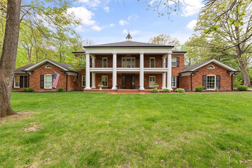 Situated on over an acre lot & surrounded by mature trees, 63 Portland exudes southern charm. Gorgeous red brick, stately columns, gas lanterns and a stunning veranda elevate this 5 bed|5.5 bath gem. 5600+ ft of living space and features a jaw-dropping 2-story kitchen, vaulted hearth room, 40x20 in-ground pool, and fabulous pool house. In addition, the main floor includes a formal dining room, wet bar,  spacious primary suite with oversized WIC and jet tub, office, an additional bedroom suite, powder room, and laundry/mudroom. 2nd level features 3 bedrooms, 2 baths, flex space, laundry and an inviting covered porch. Step out back to a lush, private oasis with wonderful outdoor features including a covered porch, private patio, pergola, and heated pool. Entertaining is simplified w/ the pool house that includes a full kitchen, full bath, living space, add'l laundry & 2 car attached garage. Full unfinished basement is ready for your finishing touches. Don't miss this opportunity! Additional Rooms: Mud Room