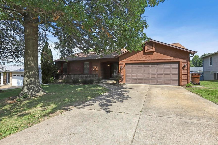 Updated Ranch-Style Home boasts 3 Bedrooms, 3 full Baths, and over 1,900 square feet of living space including the finished, walkout Lower Level! Once you step inside the Entry Foyer, you'll notice the coat closet and engineered hardwood floors that flow throughout most of the Main Floor. Family Room features a vaulted ceiling and wood burning fireplace. Updated Kitchen boasts granite countertops, custom tile backsplash, stainless steel appliances, pantry, and dining area with bay window. Master Bedroom features a walk-in closet and updated Bath. Two additional nice sized Bedrooms, a full hall Bath, and a linen closet complete the Main Floor. Finished, walkout Lower Level boasts a huge Rec Room with ceramic tile floors, Office, full Bath, Laundry Room, and ample storage space. Highlights: new 6 inch gutters (2019), arched 2-panel doors throughout, wrought iron spindles, 2-car attached garage, and neutral paint colors throughout most of the home. Walking distance to Laurel Park!