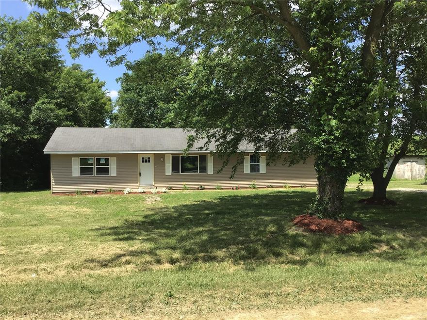 COUNTRY LIVING right in town! Why rent when you can own for less?  This home has been completely remodeled and sitting on 2 acres right on the edge of town. This is a split floor plan with master on one side and 2 bedrooms on the other side of the living areas. Upgrades galore in this beautiful ranch home including: New siding, gutters (in process) and fascia and freshly updated landscape. Inside you will find all new flooring, paint, windows, counters and sink in kitchen, interior and exterior doors and most trim replaced.  Brand new HVAC system.  There is a storage shed and a metal lean-to at the back of the property.  This is a double lot and has two water meters and two electric for future expansion.  Don't miss you chance to grab this beautifully updated home.