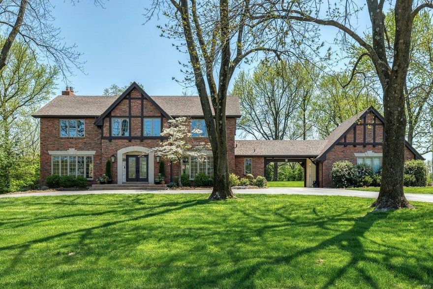 Spectacular renovation! An impressive brick, stone & cedar elevation highlights the remarkable curb appeal of this Craftsman-inspired 2 Sty. Wide tiled porch entrance with leaded glass double doors leads to gracious foyer, formal living room & dining rooms with full-height windows & spacious family room with stacked stone alcoves & porcelain fireplace with timber mantel. Designer kitchen with granite countertops, alderwood cabinetry, premium appliances & butterfly center island adjoins breakfast nook & light-filled sunroom. Master bedroom suite radiates warmth with a direct vent fireplace, customized walk-in closet & luxury bath with expanded shower. 3 Additional bedrooms, 1 with ensuite bath, & hall full bath complete the 2nd floor living quarters. Lower Level entertainment space includes recreation room, game room, family room & 1/2 bath. Situated on a parklike 1-acre lot with paver patio, water feature & fire pit surrounded by landscaped gardens. Award-winning Ladue School district. Additional Rooms: Mud Room, Sun Room