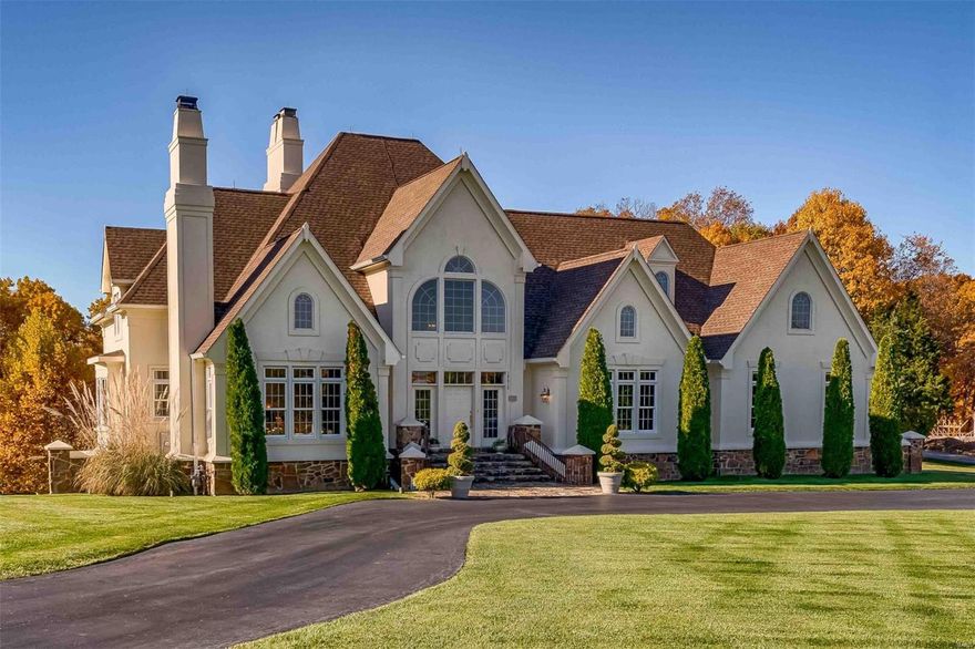 This 1.5-story estate is a masterpiece of design & craftsmanship offering over 7,200 sq. ft. of living space, including 4 beds & 6 baths. You are greeted with a magnificent curved staircase, 2-story vaulted ceilings, & intricate millwork. Wide-open, naturally bright great room leads to large, window-filled kitchen & hearth room. New appliances are accompanied by a center island, tons of cabinet space & a built in Sub-Zero refrigerator. Enjoy the vaulted dining room with amazing millwork. The airy study boasts 1 of 3 fireplaces, & is the ultimate morning coffee spot. Huge main-floor master bedroom & large master bathroom with Jacuzzi. The upper level boasts 3 spacious bedrooms, 2 full baths, & a 2nd laundry room. The sprawling lower level offers a theater room w/ projector, large rec. area, half-bath & wet-bar. Walk-out to your private stone patio with space to entertain. All of this is situated on 3 beautiful acres. You must see this home in person to experience its grandeur.