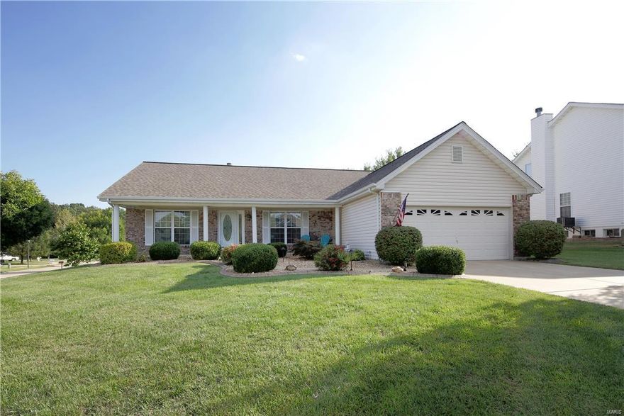 You'll love what you see the minute you pull up.  Nice landscaped corner lot on a large cul de sac.  Vinyl siding, brick, enclosed fascia and soffit.  When you walk in you will enjoy the vaulted ceilings and triple bay window with planation shutters.  It  is a very open floor plan but you still have your formal dining room.  Great built in display shelves on either side of the gas fireplace.  From your breakfast room bay that walks out onto your deck (18'x14').  It is the hard to find split bedroom floor plan.  There are wood floors in the dining room and great room.  Kitchen has granite counter, tile back splash, breakfast bar, pantry and stainless steel appliances.  In-ground sprinklers are great too!  We don't expect this one to last!