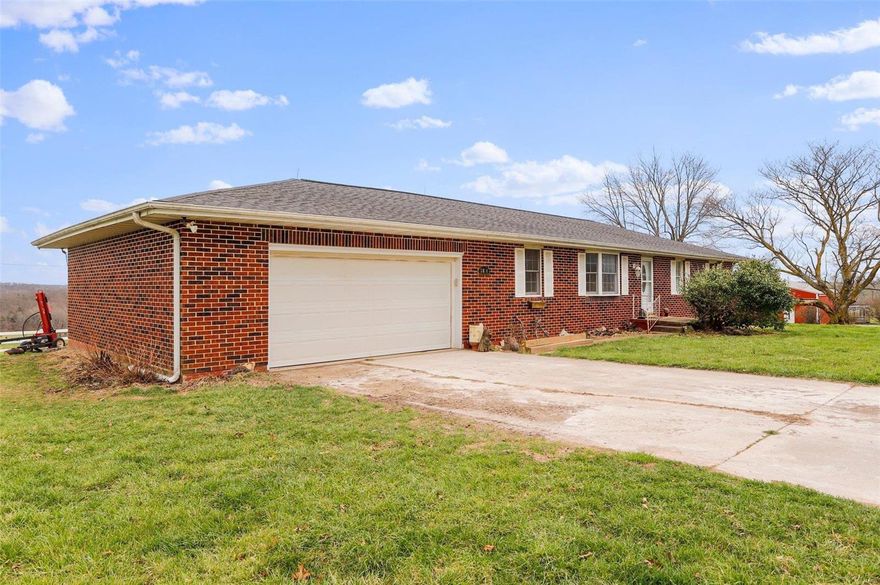 CATTLEMEN TAKE NOTICE: This beautiful working cattle farm has the finest of everything that an Ozarks farm has to offer. 230 acres with approx. 1/4 mile of Beaver Creek, multiple springs, barns, a 3 bedroom, 3 bathroom brick home and pipe fencing throughout. There are 6 automatic waterers, 11 rotational paddocks, hay fields, and a 452 foot deep well. This farm will easily support 75 cow/calf pairs and has a separate paddock for bulls. There is also working facilities, a 40x40 workshop garage, an older dairy barn that is being used for raising sheep and bottle calves, hay barns and loafing sheds. The home is a nice brick ranch style country home with granite counter tops cute country kitchen, laminate flooring, a nice brick fireplace and a full unfinished basement. The full bathroom in the basement is also a storm shelter. There is also a 1 car attached garage. Sit at your kitchen table and enjoy the beautiful views of the valley. Hunt, fish, farm, raise livestock, and live off the land