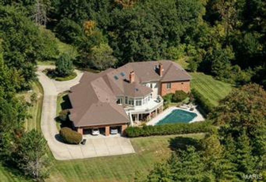 If you ever wanted to celebrate a refined Lifestyle of Luxury living in Ladue, w/prestigious size home & setting, now is the time! Rambling custom ranch, over 10,000 total SF*. Splendid pool w/gracious grounds. Ideally situated off Log Cabin Lane; zoned "Equestrian" for the enthusiast. Surrounded by Multimillion dollar homes; 3 rolling acres on an exceptional private street. Aggressively reduced over $550,000 to provide buyers room they need to create changes in cosmetics & decor. 6BD/6BA w/a fully finished walk-out, above-grade Lower Level. Soaring ceiling heights and an open floor plan make this an easy-to-live-with layout. Glassed Sunroom & deck. Job-finished wood floors. Main level Master w/sitting room & FP. 3 add'l main level BRs. 2 BRs on LL, above grade. Eat-in kitchen enjoys pantry, island & large bkfst room. Lower Level is 3000+ SF. Circle drive. 3-car garage. At this strong a reduction, property sold as-is, seller to do no repairs. (*6900 SF Main, 3100 SF LL) Additional Rooms: Sun Room