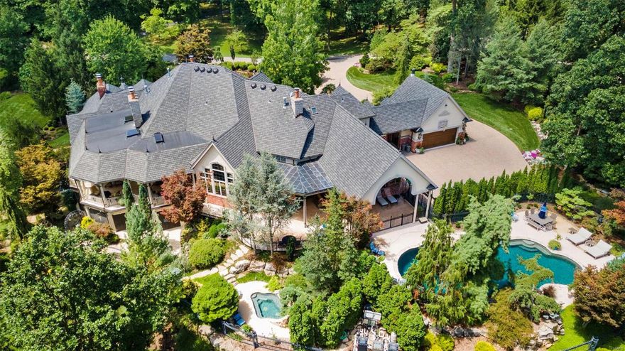 The pinnacle of luxurious living w/nearly 13,000 sq ft of living space, this captivating home is in harmony w/the botanical gardens & outdoor spaces that have masterfully created a resort like setting over 3 impeccably manicured acres in one of the most prestigious STL locations. Your heart skips a bit as you open the door and your eyes dance over the formal living & dining room, but you catch your breath as you have a keen sense of “home” in the welcoming living room & kitchen. Everyone wins when it comes to the 7 uniquely designed bedrooms as each includes their own private bath, w/the main level primary suite taking center stage. Finished walkout LL is sure to delight the entire family w/wine cellar, game room, theater, home gym, 2nd kitchen & sauna; and outdoor enthusiasts will relish the spectacular main level lanai w/soaring plank ceiling, vast LL screened terrace, free form pool, wading pool, and spa. This extraordinary home is one of a kind! See feature sheet. Additional Rooms: Wine Cellar
