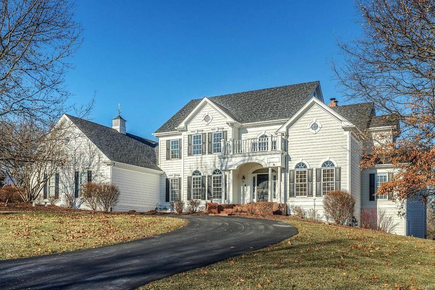 Miceli-built 1.5-sty Colonial in premier gated neighborhood! Impressive 2-sty hardwood foyer leads to private study with built-in bookcases, elegant dining room & 2-sty great room with brick fireplace, wet bar & soaring windows. Designer kitchen featuring 42” white cabinetry, granite countertops, stainless steel appliances & butler’s pantry adjoins light-filled breakfast room with convenient planning center & vaulted hearth room with wide bay window, fireplace & French doors that open to spacious deck. Main floor master bedroom suite offers a relaxing retreat with His & Hers walk-in closets & beautifully appointed bath with jetted tub. Front & rear staircases access 3 additional bedrooms, 1 with ensuite bath & 2 with Jack n’ Jill bath. Lower Level entertainment space includes huge recreation room with wet bar & family room with floor-to-ceiling fireplace plus office & full bath. Situated on a premium cul-de-sac lot adjacent to 4 acres of wooded ground with deck, patio & 3-car garage.