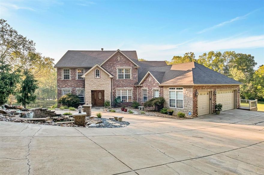 This exquisite home with over 5,000 finished square feet sits on 4+ acres of beautifully landscaped grounds, featuring an in-ground pool with stunning views of the serene 1 acre stocked pond. The grand living room offers a floor-to-ceiling stone, woodburning fireplace, custom built in shelving, and a wall of windows that bring natural light and breathtaking views of the pool. The chef’s kitchen is complete with granite countertops, a large island, and a cozy hearth room with a second wood burning fireplace that’s perfect for relaxing. The main floor primary suite includes bathroom w/dual vanities, a separate tub, and a shower. The main level also has an office and laundry room. Upstairs, you’ll find three spacious bedrooms and a huge loft. The expansive lower level includes a 5th bedroom, a large entertaining space, and a built-in bar. Recent updates include 2 new water heaters, newer furnaces and AC, and fresh paint on the main level. Perfect for those seeking both luxury & comfort! Additional Rooms: Mud Room