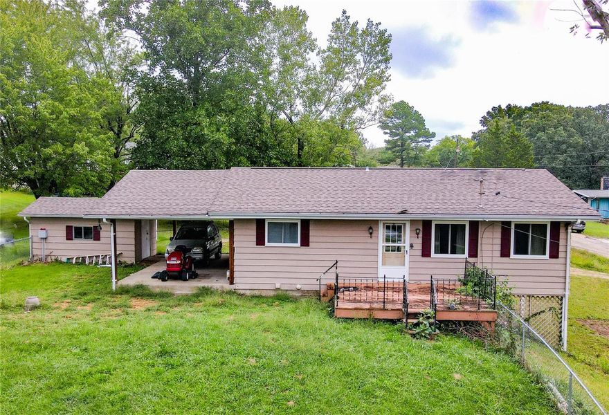 This three bedroom lake view home is priced to sell. Located on a double lot with fenced front yard, within walking distance to the lake. This property also features, updated windows, newer roof, full walk-out basement and a carport.
