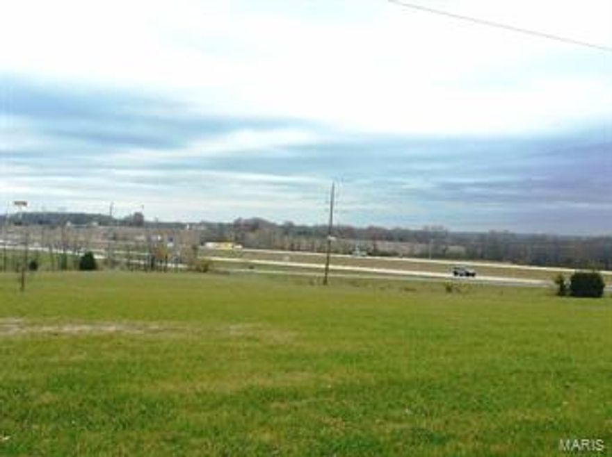 Great Commercial Potential at Prime Location with easy Hwy 61 Access at the new Hwy U/Crossroads Blvd. overpass.  Over 3000 feet road frontage on a newly paved asphalt road.  Electric on site, sewer and water are available.