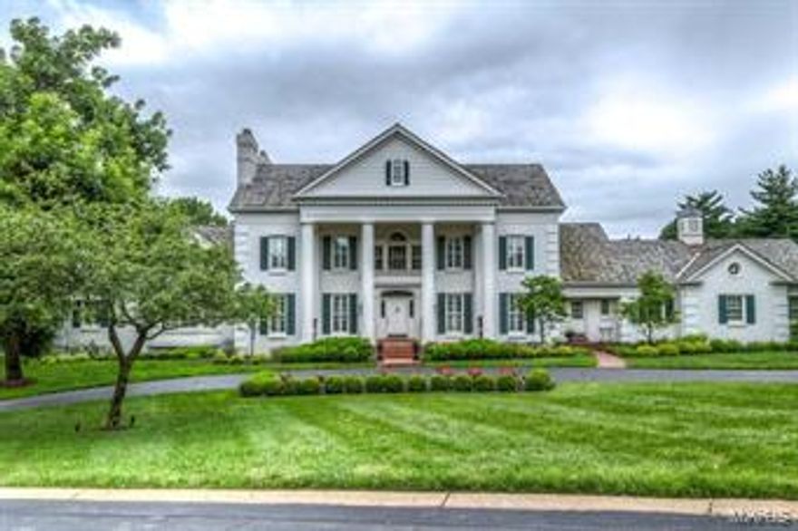 A truly magnificent 1.5 Sty Southern Colonial on 2.3 acs!  Expansive windows provide unsurpassed views while hardwood & marble flooring, elaborate millwork & plantation shutters add to the home’s graceful ambiance. 2-sty marble foyer leads to formal living room with marble fireplace & built-in bookcases, elegant dining room, library-paneled family room with brick fireplace & vaulted sunroom with wet bar. State-of-the-art kitchen with cherry cabinetry, granite countertops, Viking appliances, center island & butler’s pantry adjoins breakfast room & inviting 4-seasons room. Coffered master bedroom suite features den with fireplace & lavish bath. The 2nd floor extends the living quarters with 4 additional bedrooms, 2 with private baths & 2 with Jack n’ Jill bath.  Incredible Lower Level with recreation room with wet bar, game room, exercise room, wine cellar & bath. Grounds include lanai, pool, covered patio with stone fireplace & pool house with 5-car garage plus heated 3-car garage. Additional Rooms: Sun Room