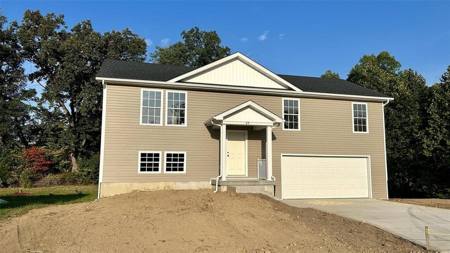 This beautiful new construction home is located next to Cuivre River State Park!  This split foyer home features 3 bedrooms and 2 baths, with some fantastic features.  It has upgraded great shaker cabinets, granite countertops and laminate flooring.  The master bathroom has plenty of room and has a double vanity.  It will include a stainless-steel appliance package!! The natural light and layout of the home make it extremely inviting.  This home has 2 car tuck under garage and a nice covered entryway.  A great home and great location!

Home is currently under construction and will be completed prior to closing.