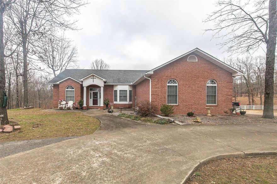 This large elegant home is country living close to town.  Home features 3 bedrooms, 3 baths, 2 double garages, full finished basement, 1600 square foot insulated shop, and features engineered hurricane walls. This 11 acre paradise has a concrete entrance with circle drive and white vinyl fencing on three sides.  Stocked pond ready for an afternoon of rest and relaxation.  All this for $399,900.