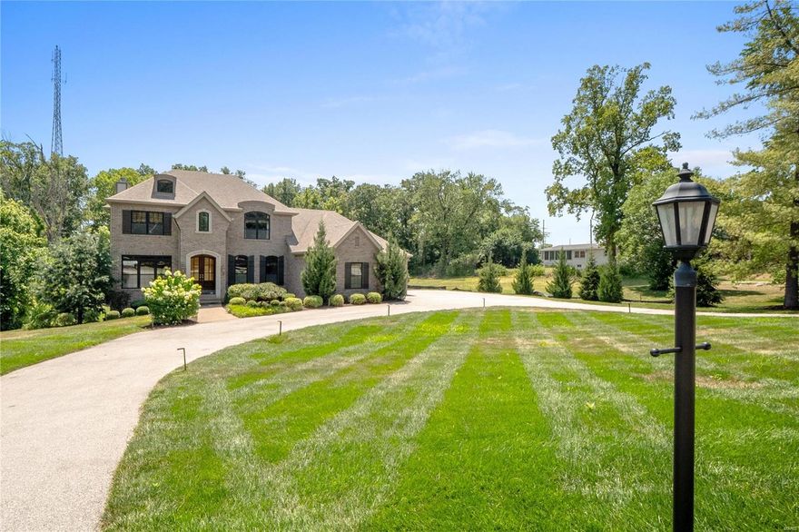 Open House 10/2 from 1-3 PM! Sitting on nearly a 1 acre lot, this stunning all brick 2-story, 5 beds/5 baths/ w/ 5,749 total sq ft Westwood home, won't last long! Notice the mature landscaping as you pull into the circle driveway. The ML entry opens to a study & dining room on each side & continues to the great rm w/ 11 ft ceiling & fireplace. Entertain family & friends in style in the updated kitchen, fully equipped w/ custom cabinets, granite counters, luxury backsplash, high-end appliances, open to the hearth room w/ coffered ceiling & 2nd f/p. The ML master suite offers a walk-in closet, dual sinks & sep. tub/shower. Upstairs boasts 3 bedrooms all w/ bathrm access & loft area. Add'l living space in finished LL w/ family rm, wet bar & kitchenette, 5th bedrm, updated bath, exercise room & storage. Add'l features: 3 car garage, composite deck, ML laundry, impressive crown molding, wainscot, hardwood floors, steps away from Mercy Hospital & easy access to Hwy 40 & I-270. Welcome home!
