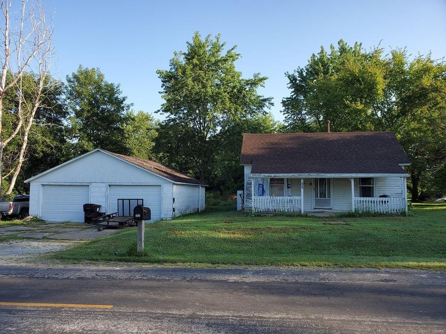 Take a second look!  With a few finishing touches, you'll have an affordable home on quiet Canton St in Lewistown, MO.  Sitting on an oversized lot with a private back yard, nice 2-car garage/workshop, and in a great neighborhood, this one is walking distance to the city park & ballfield.  The interior has a new heat pump/central air unit & on-demand hot water heater, the original hardwood floors, a big kitchen, spacious master bath (with jacuzzi tub!), and full bedroom.  There is room to add on to the back of the home, and all of those materials will convey.  The garage has new LED lighting & overhead garage doors.  Utility providers here include Ameren Electric, City of Lewistown water/sewer/trash, and CenturyLink Internet.  This is in the Lewis County C-1 School District, and a quick 20-min drive to the schools or 30-minutes to Quincy, IL.