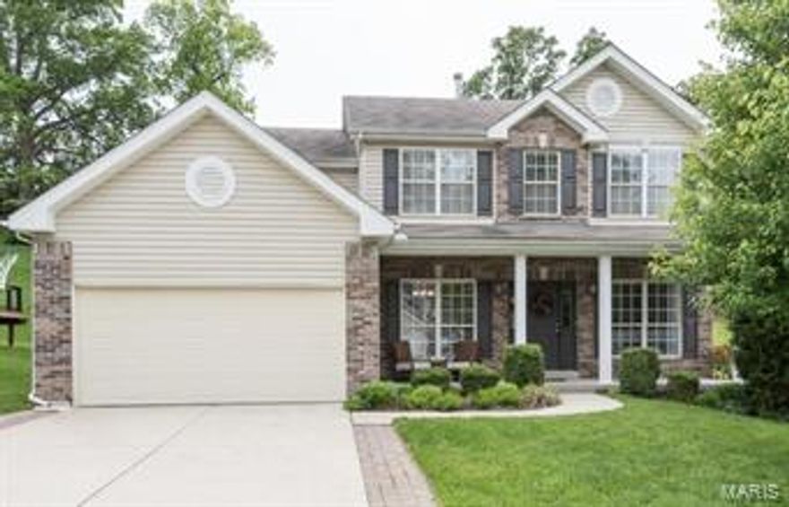 Beautiful 12 yr old home with 3 CAR TANDEM GARAGE! Open floor plan, 9 foot ceilings on main floor. Gorgeous wood floors through the foyer, kitchen and breakfast room. Family room with built in bookshelves flanking the gas fireplace and 5-bay window. Gourmet kitchen with 42 inch cabinets, granite counters, tile back splash, large island with pot rack above, black appliances including a newer dishwasher, pantry, and breakfast room bay window. Half bath with tile floor. Upstairs are 4 large bedrooms including a master bedroom suite with walk in closet leading straight into the 2ND FLOOR LAUNDRY ROOM! Master bath with separate tub/shower, dual sinks, additional full bath off the hall. FINISHED LOWER LEVEL with large rec room featuring a wet bar and full bath. Additional features include ZONED HVAC, central vacuum system, newer carpeting. Private back yard nicely landscaped with patio and pergola. Great street with lots of children playing, walk to Twin Oaks park, and close to highways!