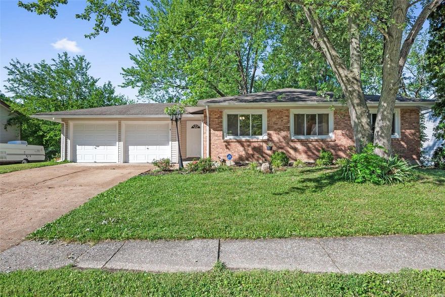 This ranch w/updated kitchen & baths & walk-out lower level is tucked in a quiet neighborhood near I-70 & Mid Rivers Mall Dr. w/lots of shopping, dining, & conveniences nearby! Granite counters, crisp white cabinets, tile backsplash, pantry, rolling island, & newer stainless steel appliances, including a 5-burner gas range & fridge (which stays!), in the beautiful kitchen. Primary suite features 2 closets & private bath w/multi-head tile shower. All bedrooms & main living area have easy-care, durable laminate plank floors. Gather in the family room w/big front window or 2 separate living spaces in the finished walk-out lower level, which also has a full bath w/lovely tile work & bonus room perfect for a home office. Enjoy the shaded backyard from the patio (patio furniture & fire pit stay). Washer & dryer included. Nice storage in the 5' bump out in the garage. Ft Zumwalt (East High) Schools. With some cosmetic updates, this home could be a stunner! What an opportunity! See it today!