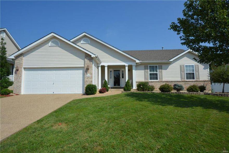 Gorgeous 3BR 3BTH great rm style ranch that is ready for you to call it home! Exterior boasts great curb appeal w/brick & vinyl front, covered porch, lush landscaping & 2 car garage. Walking in the entry foyer w/gleaming HW floors you'll notice the spacious open floor plan & fresh neutral paint, that shows like a display. The vast great rm w/tall vaulted ceilings features & gas FP flanked by windows. You'll love the kitchen w/custom cabinetry, center island w/bkfst bar, tile backsplash, pantry, brkft rm w/bay window & door to the large covered patio, overlooking the fenced yard, perfect for outdoor entertaining & enjoyment. The luxurious master suite features walk-in closet & deluxe BTH w/dual sink vanity, soaking tub & sept shower. 2 add'l BR, full BTH & laundry on main. The finish LL offers a family rm, possible 4th BR & full bth bringing the total living area to over 2200+SF! Great location w/easy access to major hwys, Splash Station Aquatic Park & Wentzville schools! A MUST SEE!