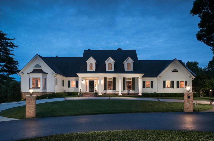 Gracious style and sophisticated finishes set this lovely Ladue estate apart from the rest. The 11-year old home includes exceptional architectural details such as cathedral ceilings, large windows and exceptional millwork. A spacious foyer leads to the spectacular living room, dominated by a large Palladian window and wood burning fireplace. The adjoining dining room includes a stunning crystal chandelier and showstopping views of the pool and patio. The gourmet kitchen boasts stainless appliances, with adjoining breakfast, bar and entertainment areas. The main level master suite is an inviting respite, with his & hers bathrooms and two enviable walk-in closets. A second main level bedroom is ensuite. Downstairs, the walkout lower level has two ensuite bedrooms, game room, family room with lovely built-ins and a wetbar. The grounds will astound and delight, with a picturesque pool, patio and manicured 1.1-acre grounds. Three car garage & Ladue Schools complete this stunning offering.