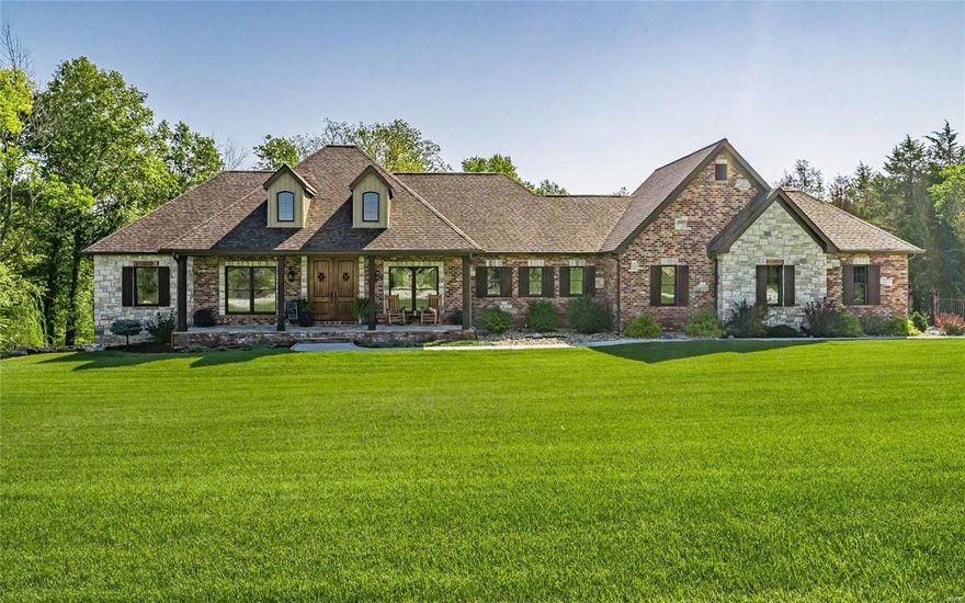 Looking for resort style living? Then this is the home for you! This 4 year old custom built home is situated on over 6 acres with an in-ground lagoon shaped swimming pool, 20X14 covered patio, 38x25 attached garage, 30x24 detached garage, & finished walk-out lower level. From the moment you arrive you will be wowed with the beautiful craftsmanship-brick & stone front, cedar posts, stone front porch, & solid wood front doors with speak easy-and that is all before you even enter the home! The interior features hickory hand-scraped wood floors through the living area, black Anderson casement windows, 12ft ceiling in the Great Room with wood beams and a gas fireplace. The Kitchen has a 6-burner gas cooktop, double wall oven, & a 12ft island! Divided bedroom floorplan with a large Master Suite, two additional bedrooms with jack-and-jill bath on the main. The lower level has a rec room, bedroom and an office. Enjoy your evenings by the pool, the firepit, or on the riding/walking trails!