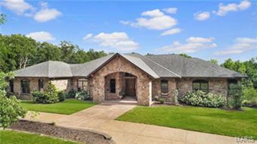 Incredible custom stone ranch situated on 32 breathtaking acres. Tucked away on your own private estate as you enter the home you will find soaring vaulted ceiling and an open stairway to the lower level. Off the foyer you will find a private study with built ins and a large dining room perfect for family gatherings. The vaulted great room with custom ceiling has a charming stone see thru fireplace to hearth room. Gourmet kitchen has custom cabinets, huge island/breakfast bar, granite and sub zero refrigerator and opens to breakfast room and hearth room. Main floor master suite with luxury bath and huge walk in closet. Additional main floor bedroom and full bath. Finished walk out lower level with 2nd kitchen, game room, rec room, bedroom and bath. Screened porch, 3 car garage & more. Your very own private retreat awaits you!