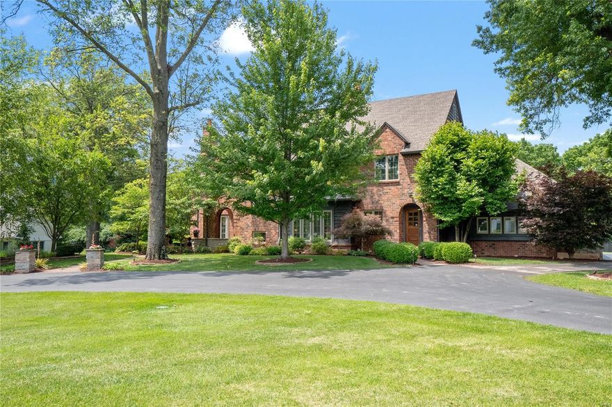 Under Contract Waiting relo to sign contract. The floor plan feels classic yet very fresh. The family room has a soaring box beamed ceiling and grand stone fireplace. The family room also includes a wonderful wet-bar with all of the features that make entertaining fun.The expansive kitchen is open to the family room & offers the owner all the amenities one desires in this caliber of home. The formal dining room shares a two-sided gas fireplace with the kitchen. The main floor primary suite is just off the office/den and has access to the screened porch that overlooks the beautiful pool. With two walk in closets, two separate vanities, a walk-in shower and air jetted tub, this is the perfect bathroom. Upstairs are 3 bedroom suites plus a bonus family room. The lower level is a special world of its own with a theater area, game rooms, custom bar with two beverage centers, exercise room, 1.5 baths and plenty of storage too. Outside you will find a pool, putting greens and a private yard.