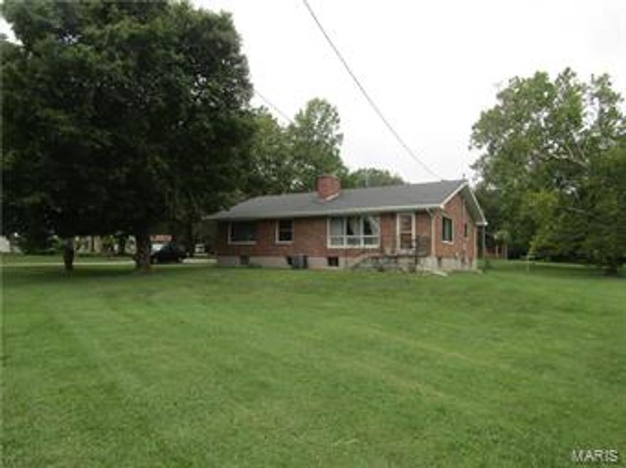 You can't go wrong with this very well built, full brick home!  The property features 3 very large bedrooms, 2 full baths, 2 wood burning fireplaces, and has been updated throughout including the kitchen and main bathroom.  Located just out of Farmington city limits on 2.4 acres, with a detached garage that has electric and water is a perfect setup for any family looking for room to grow.  Tons of closet space, and a full partially finished walkout basement ensures that you won't run out of room anytime soon.  The 2 car attached carport with brick columns will keep you out of the weather getting in and out.  Don't miss out!