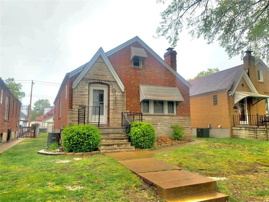 Charming all brick gingerbread constructed home.  This 2 bedroom, 1.5 bath has your classic south city floor plan with open floor plan concept and large windows that bringing in a lot of natural to the spaces.  Separate dining room is the center of the home and gives access to two nice size bedrooms, newly updated hall bath, kitchen and sunroom.  The kitchen is updated with espresso cabinets, mosaic tile backsplash, stainless appliances, cabinet pantry and center island that is great for those quick meals.  Off the kitchn is the sunroom that gives access to fully fenced in backyard and 1 car detached garage.  In one of the second bedroom there is a stairway with access to unfinished attic space- this would make great additional space and sqft.  The walk out lower level is partially finished with 1.5 bath, small bar area and large family/rec space as well as a ton of unfinished space for storage.  All of this with a convenient location, a ton of updates, this home  truly is a winner!