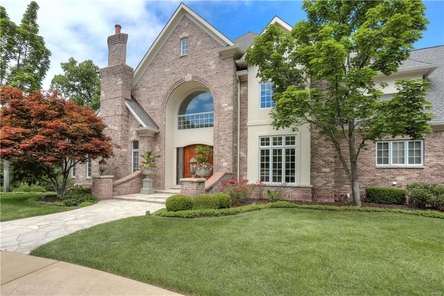 Stunning home w/close to 9400 sqft of total living space awaits you in this 5 BR/7 BA Estate on the highly desirable Ballantrae Dr in Frontenac.  The 2-story entry w/custom molding & marble floor flanked by formal dining & living/den will wow you as soon as you enter. Step through 1 of the countless archways in this home as you enter your sunken living room w/marble surround w/b fireplace & grand 2-story ceilings. A heath rm w/cathedral ceiling is just off your Gourmet Kitchen & breakfast room featuring custom cabinetry, oversized island, walk-in pantry, granite counters & high end appliances. Your main floor Master Retreat provides bay window, tray ceiling, wb f/p & amazing bath w/jacuzzi tub & huge walk-in shower w/seat & sprayers. Upstairs find 3 large BRs & 2 full BAs. Finished walk-out LL will impress w/theater, rec rm, fitness rm w/spa & more! Private backyard oasis w/covered patio, in-ground pool & lush landscaping. Oversized 4 car garage w/ample storage! This one is a must see!