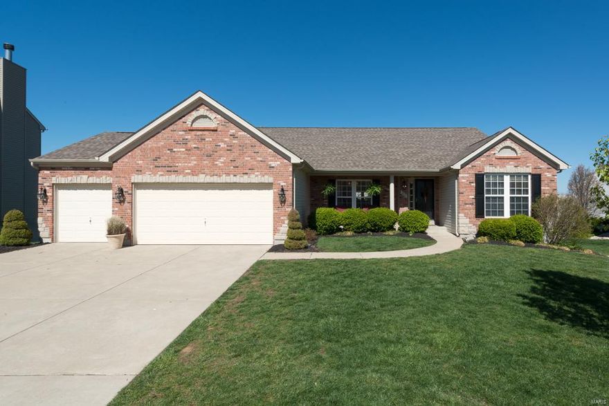 COME HOME TO YOUR HOUSE BEAUTIFUL in this impressive rambling ranch with a sought-after divided-bedroom floor plan and distinctive updates. The open-concept main-living area is adorned with a soaring cathedral ceiling and hardwood floors, setting the stage for luxury. Gleaming white bookshelves & a woodburning fireplace take center stage in the gorgeous Great Room. A classic Kitchen with white cabinets, stainless steel appliances, and tall beadboard has an airy feel. The breakfast bar and gas range make entertaining easy. A corner den provides a refuge for working from home. Architectural interest is created in the Master Bedroom with a cathedral ceiling spanning the Bedroom & ensuite accented by plant shelves. With an expansive lower level (complete with 2 Bedrooms, 1.5 Baths, a huge Rec Room, and 2 Bonus Rooms), enjoy room for everyone! A stunning pergola &  composite decking create a lovely area for relaxing outside. Bonus: Spacious 3-car garage, lawn irrigation system. Visit today!