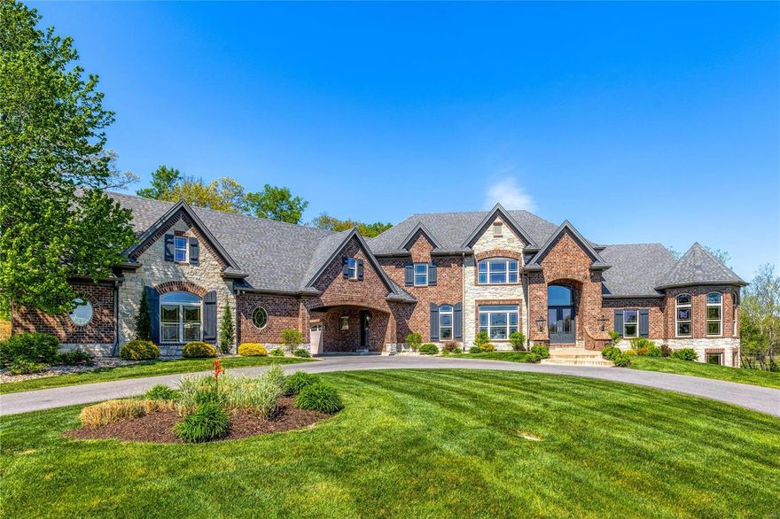 Extensively renovated full-brick Estate home from award-winning Cross Homes. Impressive 2-sty hardwood foyer leads to elegant dining room and stunning great room with dramatic bow window, box beam ceiling & direct vent fireplace flanked by built-in bookcases. Designer kitchen with 42” cabinetry, quartz countertops, Viking appliances, 12’ center island & butler’s pantry adjoins breakfast room & step-up hearth room with floor-to-ceiling stacked stone fireplace. Coffered primary bedroom suite radiates warmth with a linear gas fireplace, sitting room & beautifully appointed bath with walk-through shower spa & jetted tub. Open staircase accesses 3 additional ensuite bedrooms & vaulted bonus room. Lower Level includes recreation room with brick & stone fireplace & wet bar, game room, guest suite & ½ bath. Situated on a wooded 4.12 acre lot with outdoor living room with full-height fireplace, grilling station, hot tub patio & gunite pool plus 6 -car garage, porte cochere & auto court. Additional Rooms: Mud Room