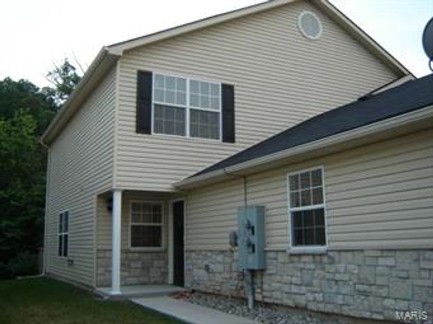 Large two bedroom townhome in pristine condition. Newer construction, open floor plan, large rooms, main floor laundry, walk-in closets, oversized one car garage, private deck, wooded view. The complex is only 4 years old and is located on a private cul-de-sac street just off Highway A and Highway 55. Convenient to shopping, highways, parks and entertainment. This is a great location.