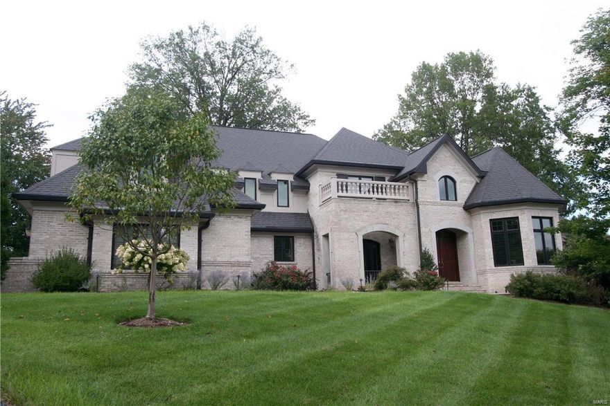 Stunning Ladue home on a private cul-de-sac. Crisp hardwood and marble floors. Extensive triple crown millwork throughout. Park like outdoor space with huge stone patio, pergola, and professional landscaping. Spectacular 2-story great room with marble fireplace, custom cabinets, and wall of windows. State of the art kitchen with high end appliances, granite counters, butler's pantry and wine bar. Huge master suite with coffered ceiling, automated blinds, walk-in closets, luxury bath, heated floors and spa shower. Two story entry foyer with dramatic staircase. Finished walk-out lower level with media room, exercise room, full kitchen and bath. Lutron smart home lighting with app control. Upgraded security system. Large office or playroom with dormer views. Architectural ceilings. High capacity attic fan. New speakers throughout provide whole house audio. Fresh paint. Open floor plan. Walk to the MetroLink, Galleria, Brentwood Market. Quick access to 40, 170, and biking loops.