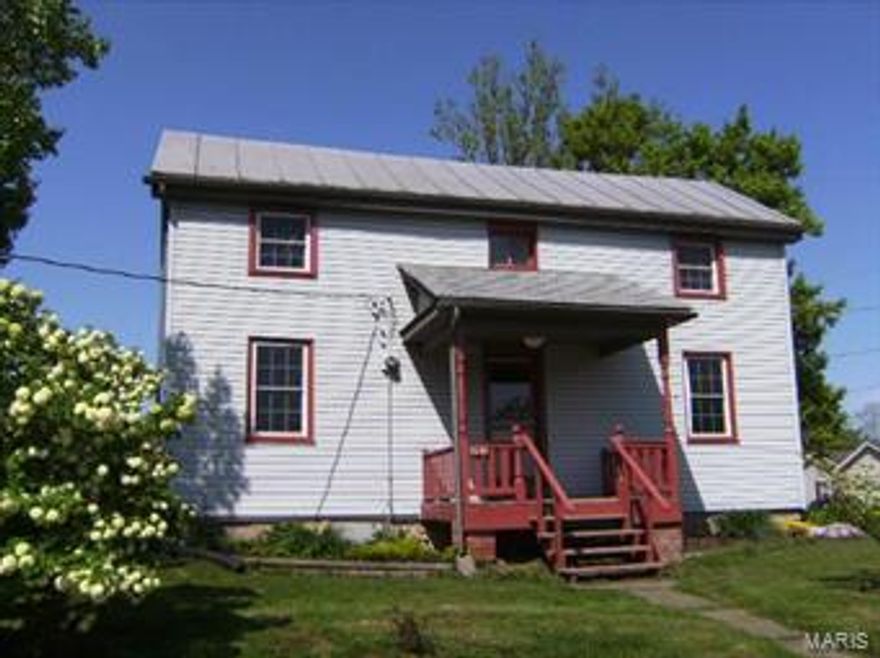CHARMING OLDER AUGUSTA HOME WITH 2-3 BRS (Living room could be converted to main floor BR), 24'x 40' 3 CAR DET. METAL GARAGE/WORKSHOP w/concrete floor & 200 amp elec. service. Home retains MANY ORIGINAL DETAILS, but has UPDATED CONVENIENCES.  NEW OAK KITCHEN CABINETS (2012), NEW MAIN WATERLINE FROM METER TO HOUSE (2011). APPLIANCES INCLUDE FRIG, GAS STOVE (2011), DW (2012). Additional updates include vinyl siding, almost all replacements windows (2 original windows on upper level), 100 amp circuit breaker panel, PEX flexible plumbing, tankless water heater, updated bath w/ clawfoot tub & shower attachment & hook-ups for a stacked washer/dryer in bath, water softener, whole house ventilation fan, ceramic tile floors in kitchen & bath.  Circular concrete driveway with patio area. Located in HISTORIC AUGUSTA, walk to Katy Hiking & Biking Trail, elementary school, library, wineries, brewery, restaurants, shops & more.  ENJOY NEARBY MISSOURI RIVER ACCESS at St. Charles County Klondike Park.