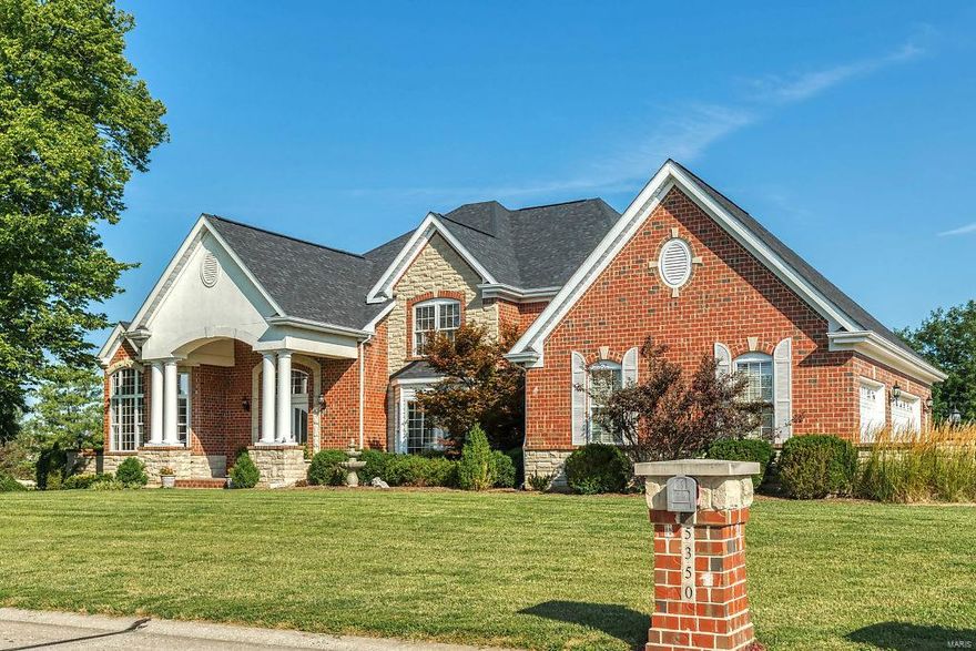 An impressive brick & stone elevation highlights the remarkable curb appeal of this beautifully designed 1.5 Sty! Impressive 2-sty foyer leads to private study with custom built-ins, coffered dining room & spectacular great room with marble fireplace flanked by lighted display cases & dramatic wall of windows. Spacious open kitchen features granite countertops, white cabinetry, premium appliances, wet bar, planning center & Brazilian cherry flooring that flows into light-filled breakfast room & vaulted hearth room with brick & stone fireplace. The master bedroom suite offers an appealing retreat with wide bay window, His & Hers walk-in closets & lavish bath with jetted tub. Front & rear staircases access 3 additional bedrooms, 1 with ensuite bath & 2 with Jack n’ Jill bath, plus bonus loft room. Lower Level includes recreation room with wet bar, family room with fireplace, office, guest suite & ½ bath. Extensively landscaped 1-acre lot with deck, covered patio & oversized 3-car garage.