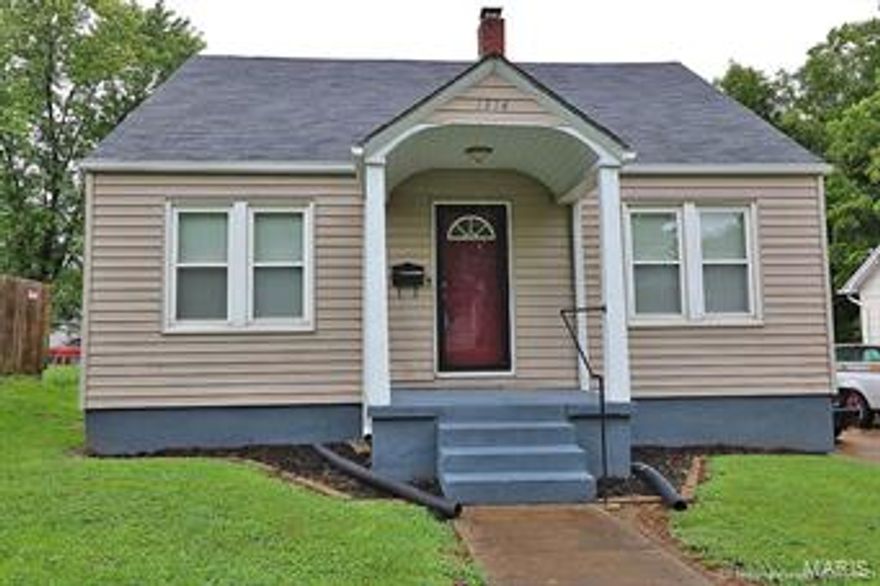 UPDATED, Move-in Ready Home! New Pergo Max flooring throughout main level, new countertops, cast iron sink, ORB light fixtures, storm doors (front & back), gutters, and basement windows. Bathroom completely updated, as well. Electrical panel updated with 220 wiring.  Charming arched doorways and built-ins from the 1940s Era. Fenced, flat backyard; off street, shared parking. Super affordable, well maintained and updated...nothing to do but unpack.