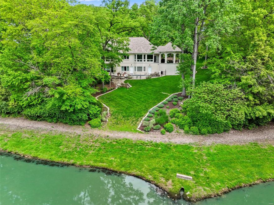 Experience luxury living in this exceptional custom-built atrium ranch, boasting 6 beds, 4.5 baths, & almost 5,000 total sq ft. Set among mature trees w/ serene lake views on a 1.3 acre lot, this home offers unparalleled privacy & stunning vistas from every room. The grand entrance welcomes you w/ soaring ceilings, a wall of windows, cozy fireplace, & built-in bookshelves. Enjoy the gourmet kitchen featuring custom cabinets, spacious center island w/ marble counter, quartz counters, subway tile backsplash, & stainless appliances all open to a breakfast room & sitting area w/ wet bar. The expansive master suite impresses w/ large walk-in closet, detailed molding, & spa-inspired bath. The finished LL is perfect for gatherings, offering: family room, 4 beds, 2 baths, ample storage, & walk-out access to a backyard oasis complete w/ patio, gazebo, in-ground pool w/ waterfall overlooking the lake. This home truly has it all! Welcome home! Additional Rooms: Mud Room