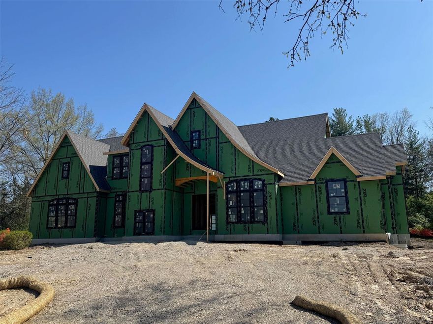 New plan & features being offered on this extraordinary custom home being built in Town & Country. A short drive to local hospitals, restaurants & Plaza Frontenac. Spacious 1+ acre lot w/ a backyard perfect for entertaining. If you like vaulted & high ceilings (up to 20’+) this house is for you. Tons of natural light w/ large windows! Approximately 5900 sq. ft of open living space w/ a main floor primary suite, main floor study, stunning dining area, three bedrooms upstairs & a finished lower level. High end appliances, hardwood flooring, a covered outdoor patio, and much more. House currently is under construction with completion in 2025. Still time to make many of your own selections. Custom built by the award winning builder, The Manlin Company. Call the listing agent for a tour of the house.