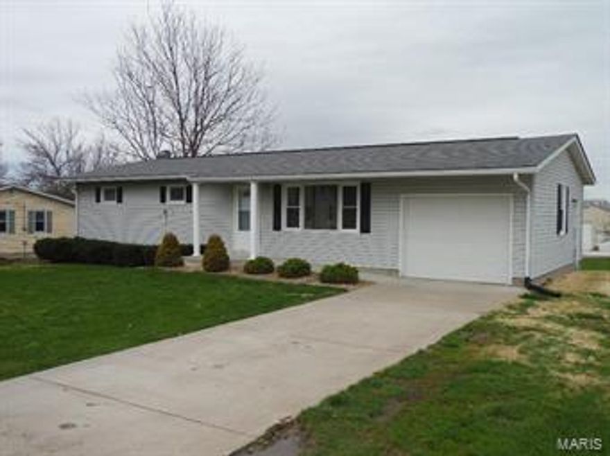 Very nice 3 BR, 1 BA home with a walk-out basement (unfinished) that is roughed in for another bathroom.  Beautiful hardwood floors in all 3 Bedrooms.  The kitchen and dining room are separated by an island that houses the stove.  Double oven in the wall of the kitchen.  This house is a dead end road, so very little traffic flow.  A 32 X 24 detached 2 car garage/workshop behind the house is perfect for additional vehicles or "toys"  This is a MOTIVATED SELLER, so act quickly if you want a chance.