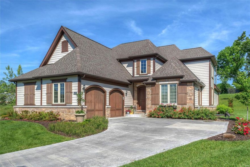 Spectacular 1.5-sty executive home in premier Ladue neighborhood! Open floor plan features extensive millwork, designer finishes & hand-scraped hardwood flooring throughout the 1st & 2nd floors. Impressive 2-sty foyer leads to private study, elegant dining room & stunning great room with wall of windows & floor-to-ceiling stacked stone fireplace. Chef’s kitchen with 42” white cabinetry, granite countertops, KitchenAid appliances, center island, butler’s pantry & convenient planning center adjoins light-filled breakfast room with atrium door to patio. Coffered master bedroom suite provides an appealing retreat with His & Hers walk-in closets & Carrara marble bath. The 2nd floor extends the living quarters with 3 additional bedrooms & hall full bath. Lower Level entertainment space includes recreation room with wet bar & family room plus 5th bedroom & full bath. Situated on a premium cul-de-sac lot with patio & oversized 2-car garage. Upscale living with included landscaping & lawn care. Additional Rooms: Mud Room