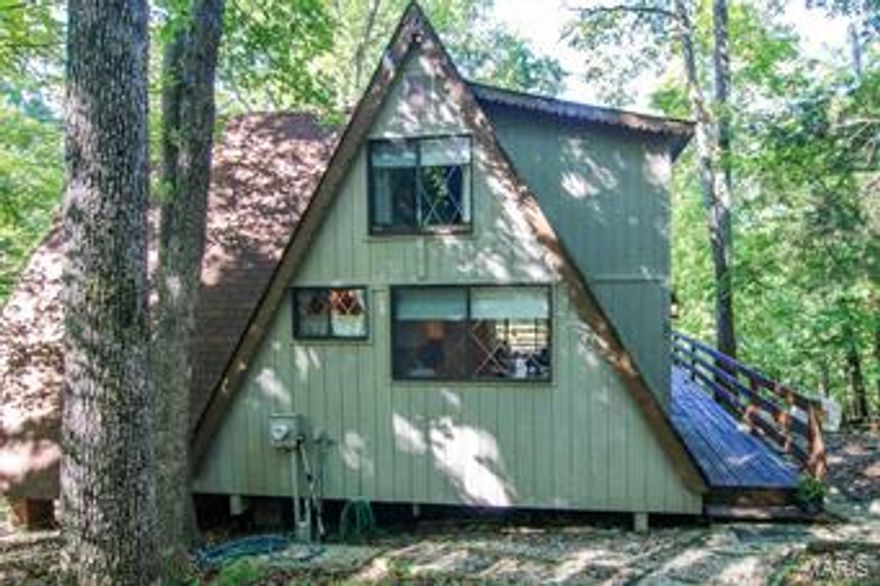 Adorable lake front chalet close to Lake Aspen. A very peaceful setting. Just a short walk down the path to your private dock right on the lake. Very charming 2 bedroom, 2 bath a-frame has a cozy feel and some very nice updates. Relax in the large main floor master bedroom. There is an additional bedroom upstairs as well as a bath and a nice loft area upstairs. Open spacious floor plan. Plenty of room for your family. Enjoy the changing of the seasons from the deck overlooking beautiful Solitude Lake. Circle driveway with additional parking area and a shed. Ready for you to move in and enjoy all the amazing amenities that Innsbrook has to offer. Golf, stables, lakes, beaches, swimming, fishing, hiking and biking and so much more! Imagine all the family fun you will have enjoying your very own Innsbrook chalet getaway.