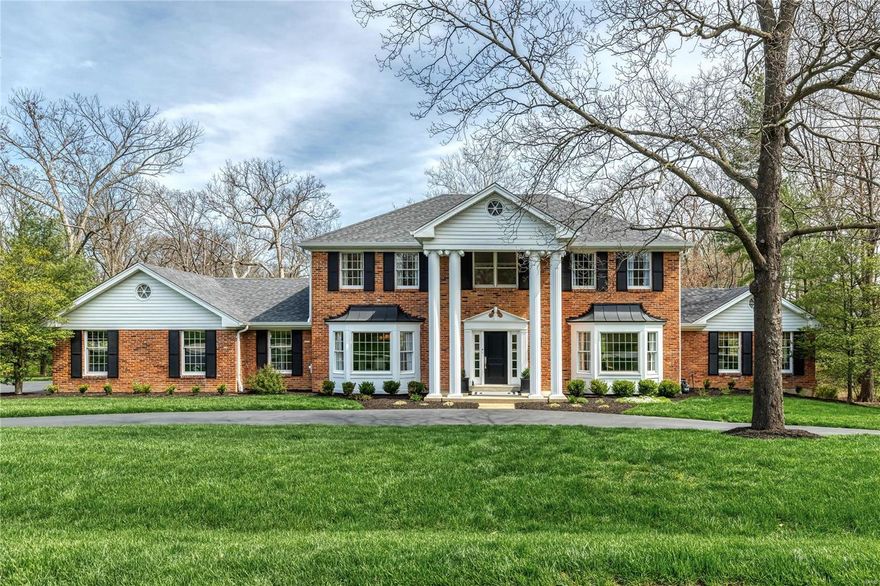 This beautifully updated Georgian Colonial features best-in-class improvements & amenities throughout including French oak hardwoods, detailed trim work, Palladian windows & contemporary lighting. Impressive 2-sty foyer leads to formal living & dining rooms with wide bay windows, vaulted study & spectacular family room with built-in wall unit, brick fireplace & French doors that open to private deck. Culinary enthusiasts will love the newly designed kitchen with quartzite countertops, 42” white Shaker cabinetry, commercial grade appliances & 9’ center island with dining table. Spacious primary bedroom suite with marble bath with freestanding tub plus 3 additional bedrooms & hall full bath complete the 2nd floor living quarters. Lower Level entertainment space includes recreation room with floor-to-ceiling stacked stone fireplace, game room with 12’ wet bar, office/workout room & full bath. Situated on a 1-ac cul-de-sac lot backing to woods with covered patio, deck & resort style pool.