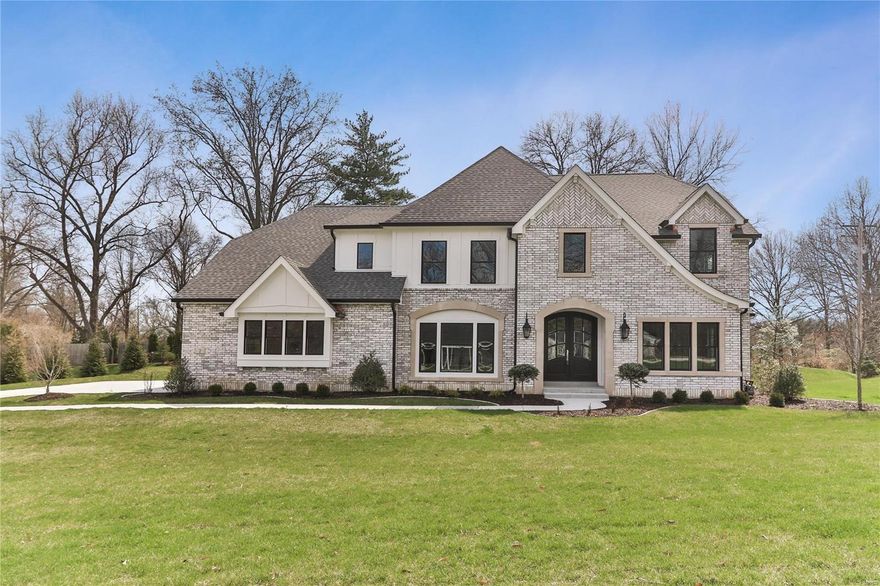 PRICE REDUCED $50,000 -  Douglas Properties is excited to announce this new construction located in the heart of Ladue.  This home features 4,520 of luxurious square feet on the main two floors and another 1,108 square feet in the lower level. The details of this home come right out of a magazine.  You will only see top of the line plumbing/light fixtures as well as a molding package that far outweighs homes priced in this category. There's a 3-car side entry garage, mudroom w/lockers/half bath before you enter the main living area.  The kitchen features Markus Cabinets/large center island with honed marble tops / Thermador appliances. The master suite features a huge walk-in closet & a stunning master bath with amazing tile work. The 1st floor has wood floors and all bedrooms have their own baths and have high-end plush carpet. We also feature an outdoor covered entertaining area with fireplace!  The finished lower level has an entertaining room w/wetbar, bedroom and even more! Additional Rooms: Mud Room