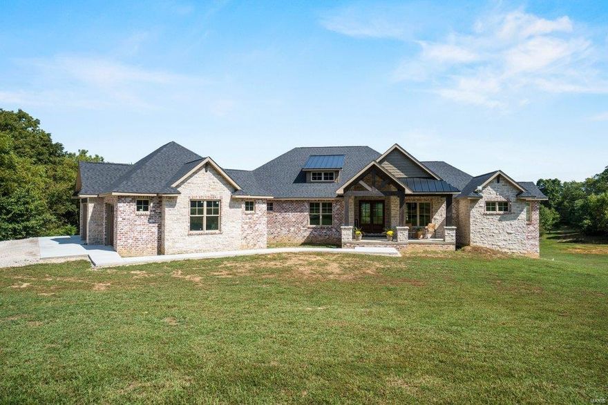 The floor plan is perfect, the finishes are impeccable, the style is trendy yet classic and the view and private land will fill all your heart desires! Custom built brand new home on acres 8 acres! 6,000 square feet that welcomes you with vaulted & timber ceiling front porch drawing you inside carrying the vault into the living space then out the back & straight into that view! Every detail is thought out - GORGEOUS designer style custom cabinets in laundry, quartz & built ins everywhere. The master suite has THAT view with an ensuite bath that is out of a luxury magazine. Full finished basement with family room, game room area, additional bedroom/bath, also has 1/2 bath located perfectly for a future pool location. Property has a fully stocked pond you can fish & kayak on, plus a barn. No covenants on property and EXACTLY 20 minutes to Target! Driveway and sidewalk will be completed this week. Additional Rooms: Mud Room