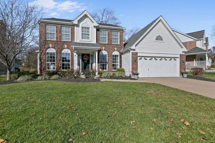 Gorgeous 2 story with over 2700 square feet of living space. Upon entry gleaming wood floors are flowing through out the main level. The upgraded kitchen is complemented with: 42" cabinets, granite counters, stainless steel appliances, planning desk, recessed lighting, and walk-in pantry. A large family room is arrayed with built in bookcases, gas fireplace, custom millwork, and large bay window. The sep. dining room and living room are arrayed with several windows that fill the home with natural light. A 1/2 bath and main floor laundry round out the main level. Upstairs, the spacious master suite features: huge walk in closet with organizers, vaulted ceiling, sep. tub and shower, and 2 sink vanity. 3 other bedrooms and an additional full bath complete the second story. The finished lower level sports: a large rec room, recessed lighting, and a wet bar. The home backs to an acre of common area. Other features: lawn irrigation system, oversized garage with 14x14 workshop, & huge patio!