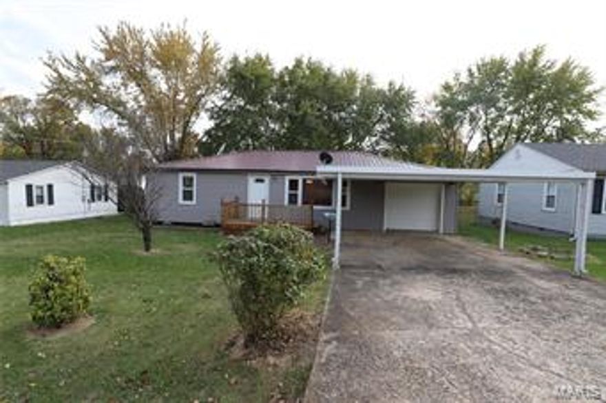 This home has been completely remodeled, and is move-in ready! New paint, flooring, water heater, and A/C.  The yard is chain link fenced, with 2 smaller metal storage sheds in the back.  You have to set an appointment to see how well this house shows! Don't wait!!